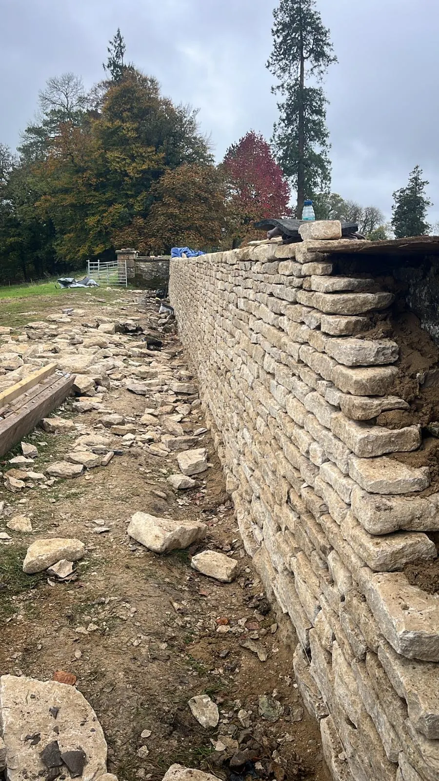 A dry stone wall under construction showing the hand-built courses