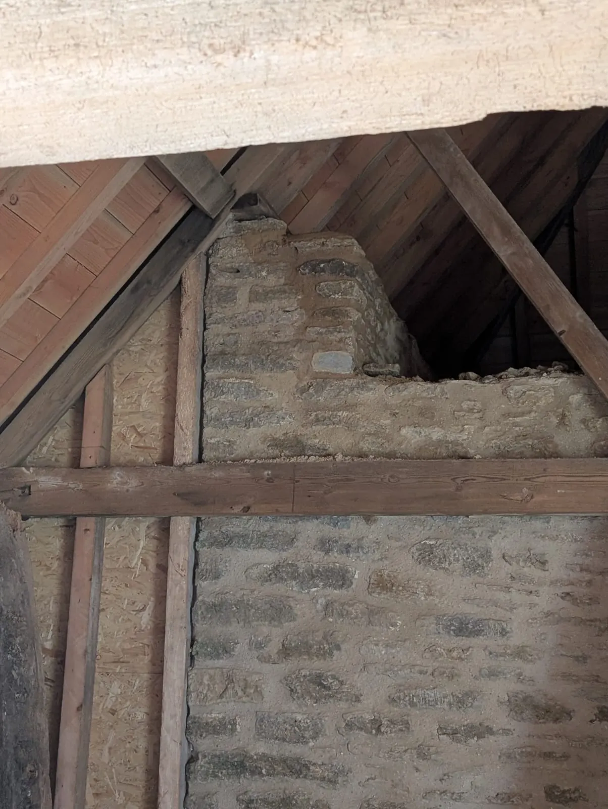 Traditional lime mortar pointing on an internal barn wall